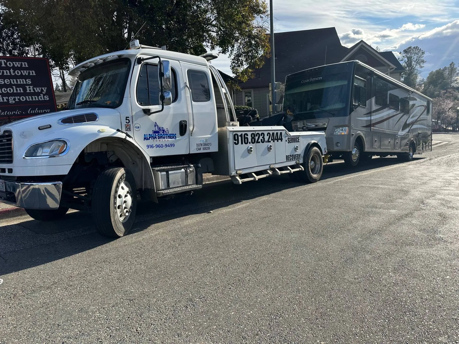 Coachmen Class A motorhome towed in Auburn by Alpha Brothers