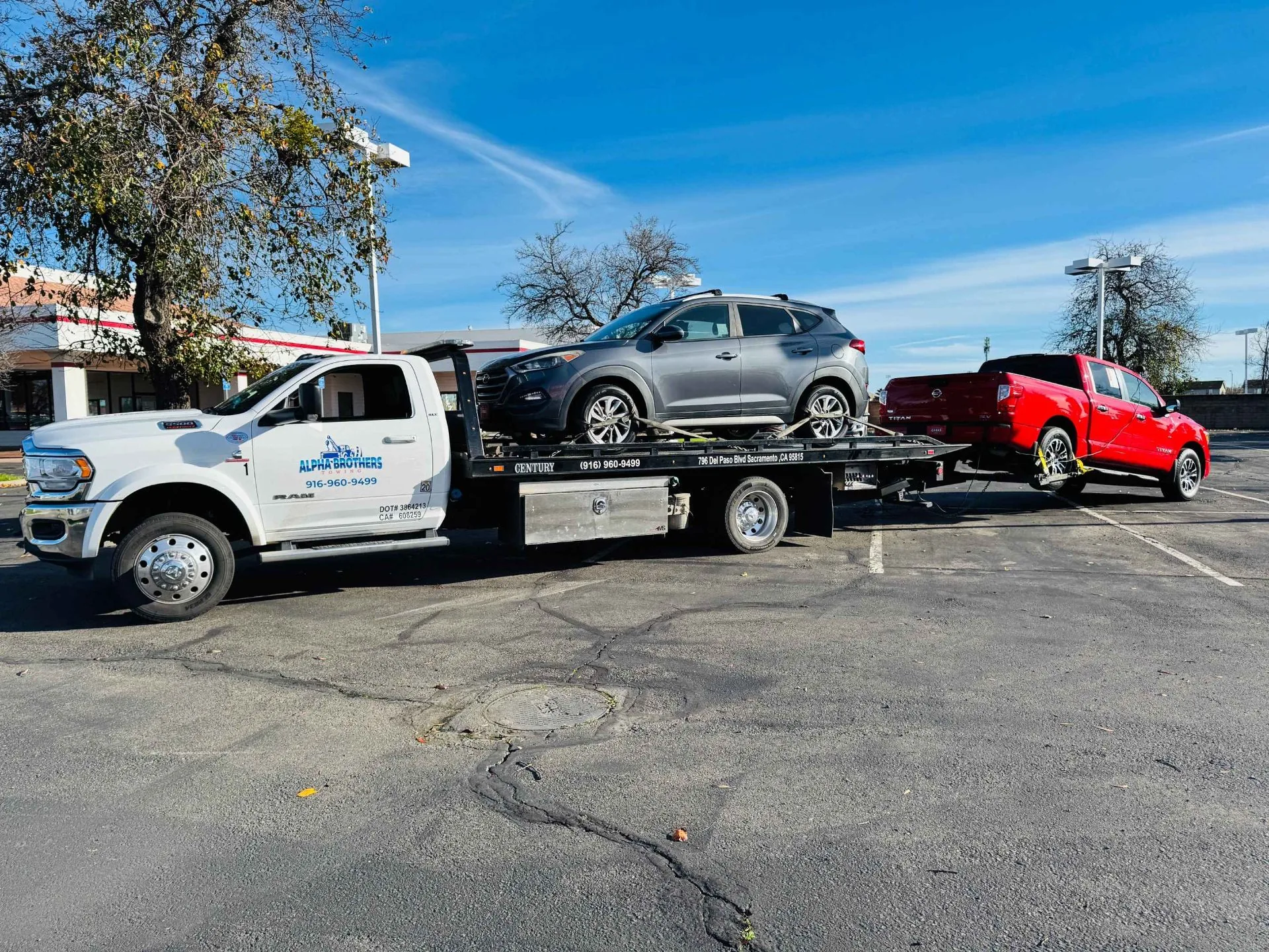 Alpha Brothers Towing loading an SUV on a flatbed truck in Sacramento